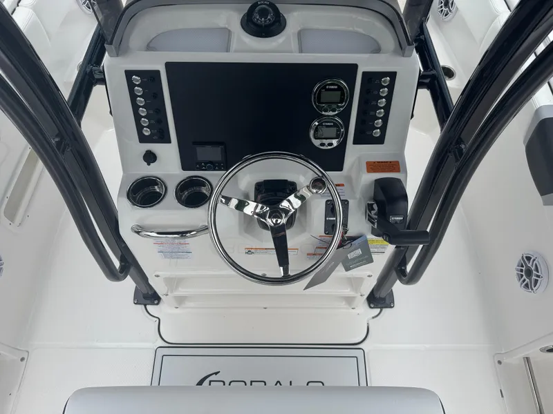 Slide: The Image of 2025 Robalo R222 Center Console dashboard with steering wheel and controls. - 4