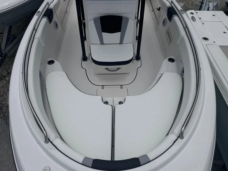 Slide: The Image of 2025 Robalo R222 Center Console boat interior with white seating and console. - 9