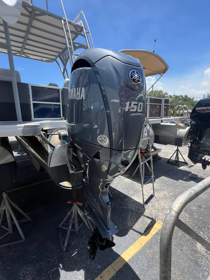 Slide: The Image of 2022 Godfrey Monaco 235 SDB with Yamaha 150 outboard motor on display. - 16