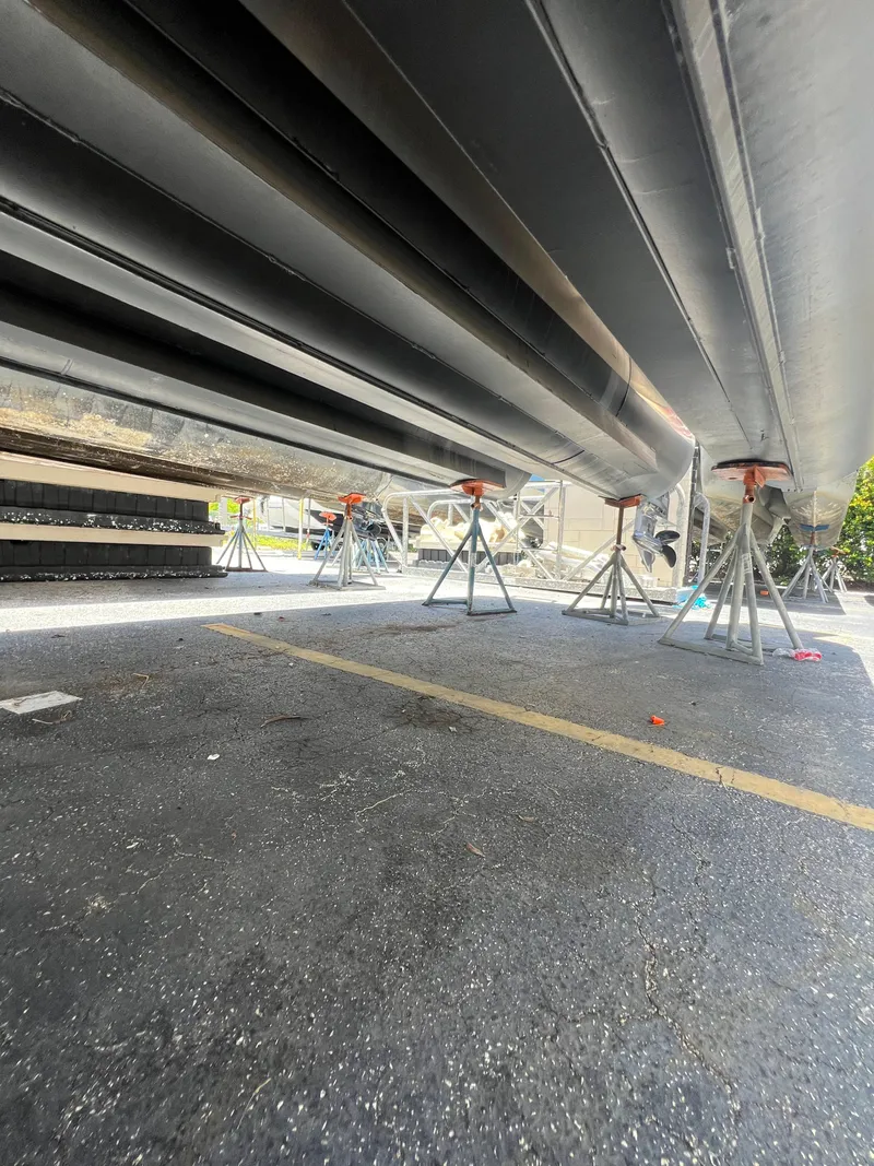 Slide: The Image of Underneath view of a 2022 Godfrey Monaco 235 SDB boat on stands. - 28