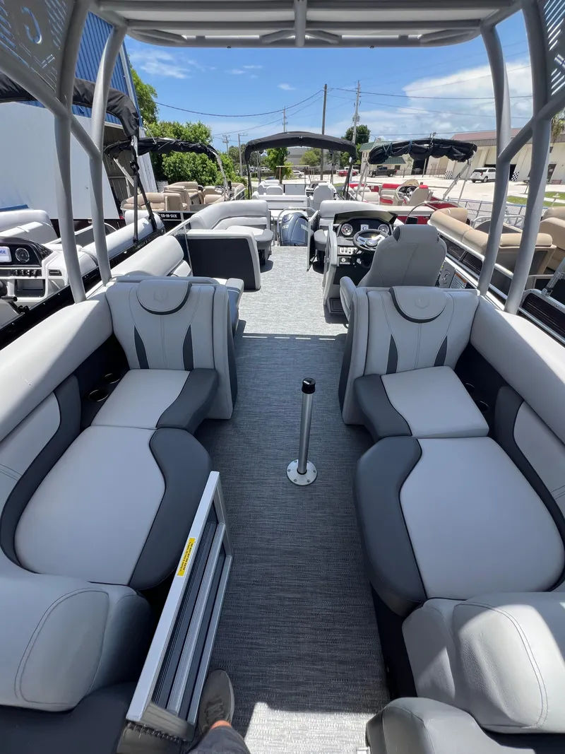 Slide: The Image of 2022 Godfrey Monaco 235 SDB pontoon boat interior with gray seating and modern design. - 3