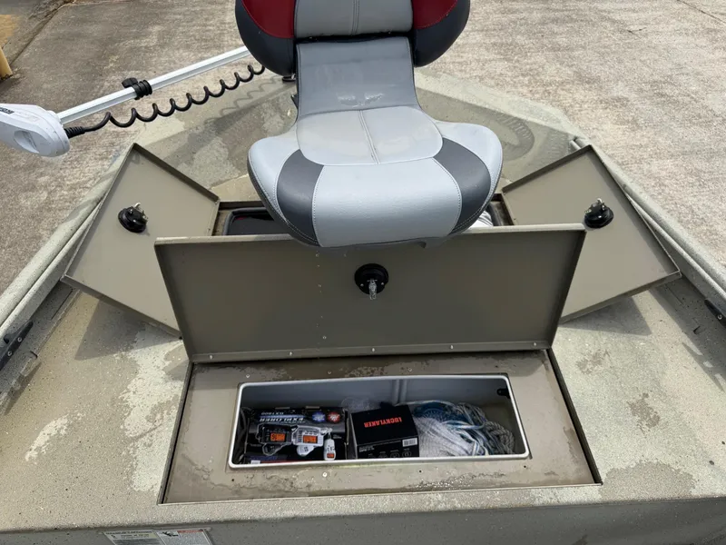 Slide: The Image of 2018 Alumacraft 1860 Bay boat with open storage compartments and seating. - 5