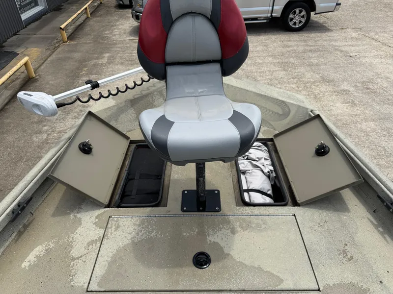 Slide: The Image of 2018 Alumacraft 1860 Bay boat with storage compartments and a swivel seat. - 6