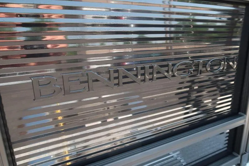 Slide: The Image of Bennington logo on metallic surface, 2026 S Quad Bench 22 SSR model. - 11
