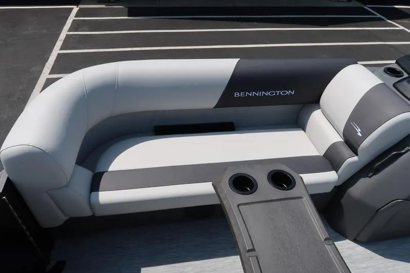 Slide: The Image of 2026 Bennington S Quad Bench 22 SSR with sleek seating and cup holders. - 12