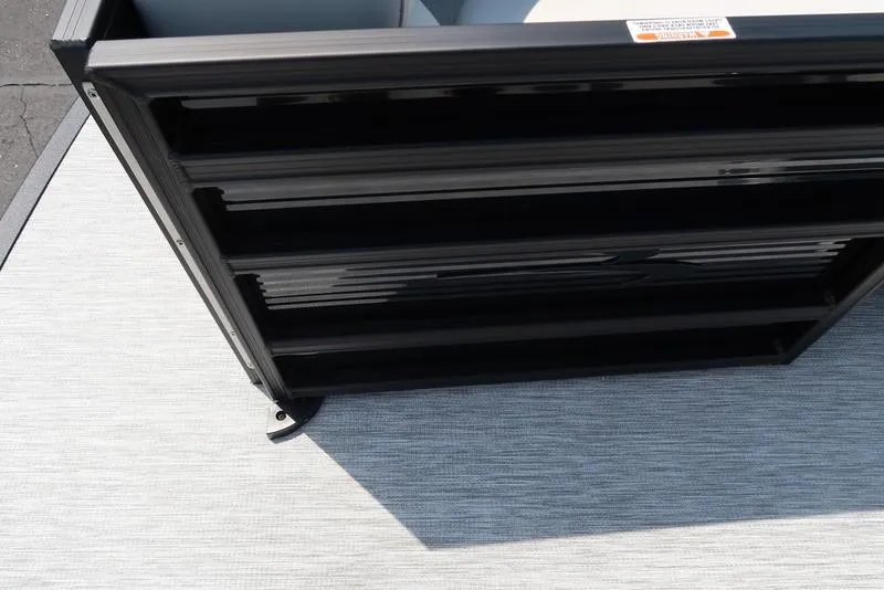 Slide: The Image of 2026 Bennington S Quad Bench 22 SSR, black panel detail on light gray flooring. - 13