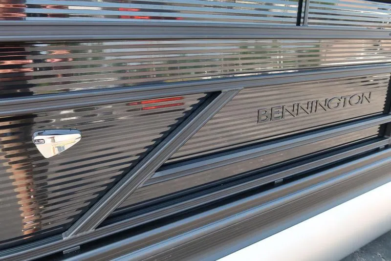 Slide: The Image of 2026 Bennington S Quad Bench 22 SSR, sleek black exterior detail. - 15