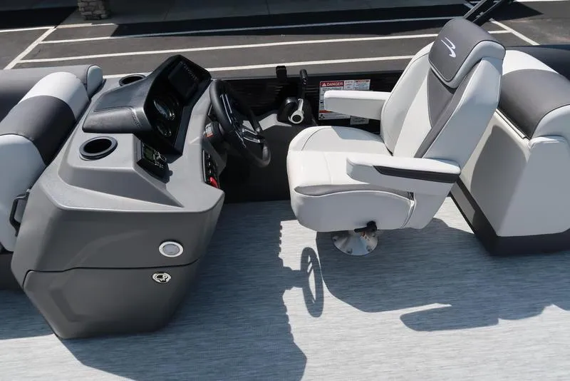 Slide: The Image of Captain's seat and helm of 2026 Bennington S Quad Bench 22 SSR pontoon boat. - 17