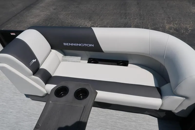 Slide: The Image of 2026 Bennington S Quad Bench 22 SSR with sleek seating and cup holders. - 22