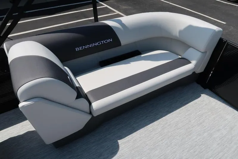 Slide: The Image of 2026 Bennington S Quad Bench 22 SSR boat seating, featuring sleek gray and black upholstery. - 24