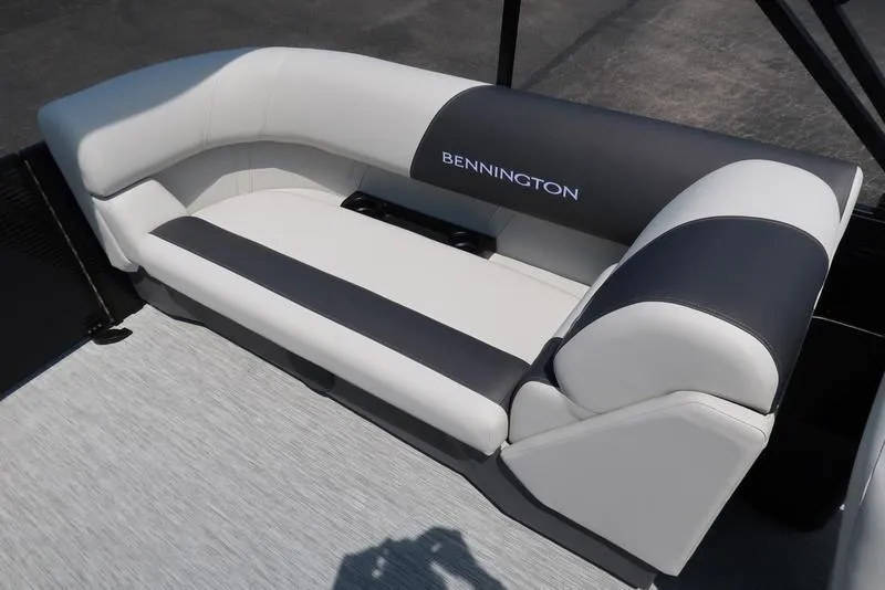 Slide: The Image of 2026 Bennington S Quad Bench 22 SSR boat seat, featuring sleek black and white upholstery. - 25