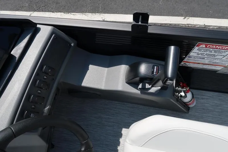 Slide: The Image of 2026 Bennington S Quad Bench 22 SSR boat console with controls and safety instructions. - 33
