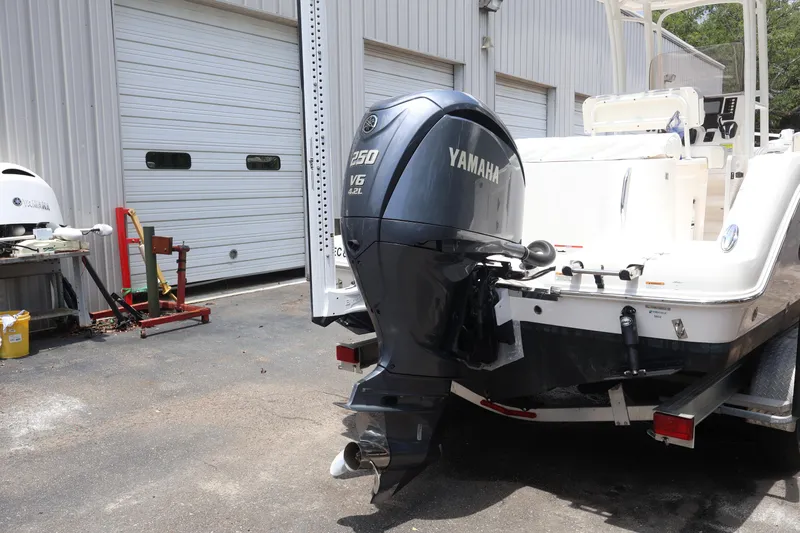Slide: The Image of 2022 Robalo R222 Center Console with Yamaha 250 V6 outboard motor in a garage setting. - 11