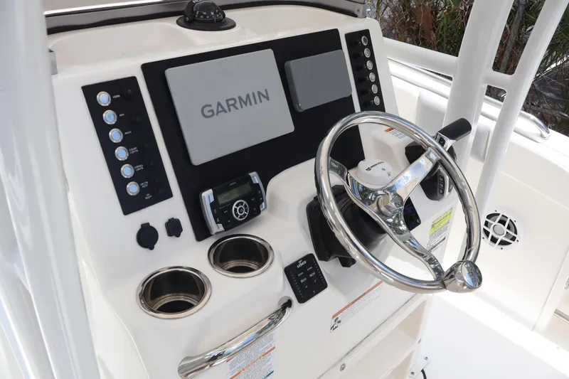 Slide: The Image of 2022 Robalo R222 Center Console dashboard with Garmin display and steering wheel. - 14