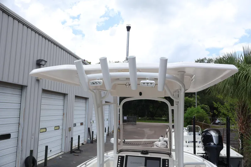 Slide: The Image of 2022 Robalo R222 Center Console boat with T-top and rod holders. - 15