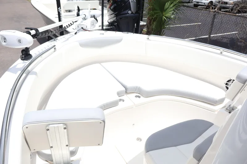 Slide: The Image of 2022 Robalo R222 Center Console boat interior with white seating and modern design. - 5