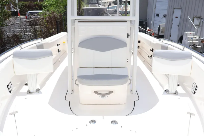 Slide: The Image of 2022 Robalo R222 Center Console boat interior with white seating and console. - 7