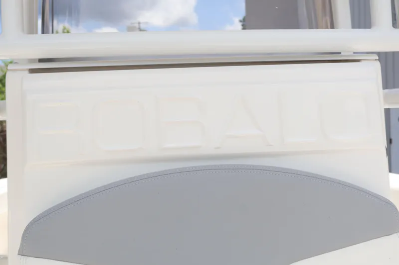 Slide: The Image of 2022 Robalo R222 Center Console boat with embossed logo and cushioned seat. - 9