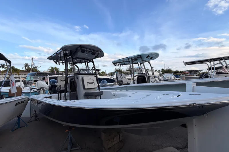 The Image of 2026 Sea Pro 230 Bay boat displayed in a marina under a blue sky. - 0