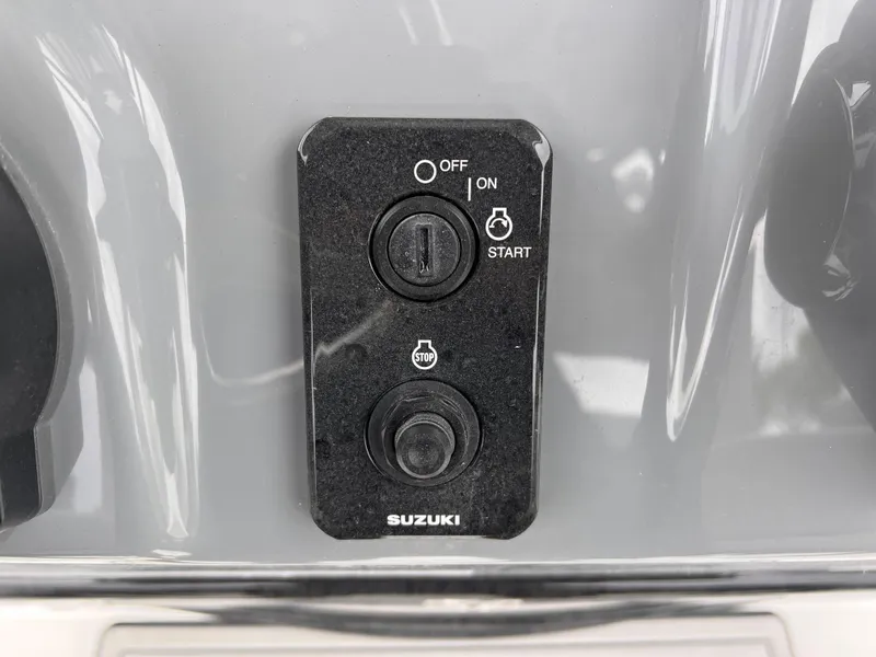Slide: The Image of Control panel of a 2026 Sea Pro 230 DLX boat with Suzuki ignition. - 13