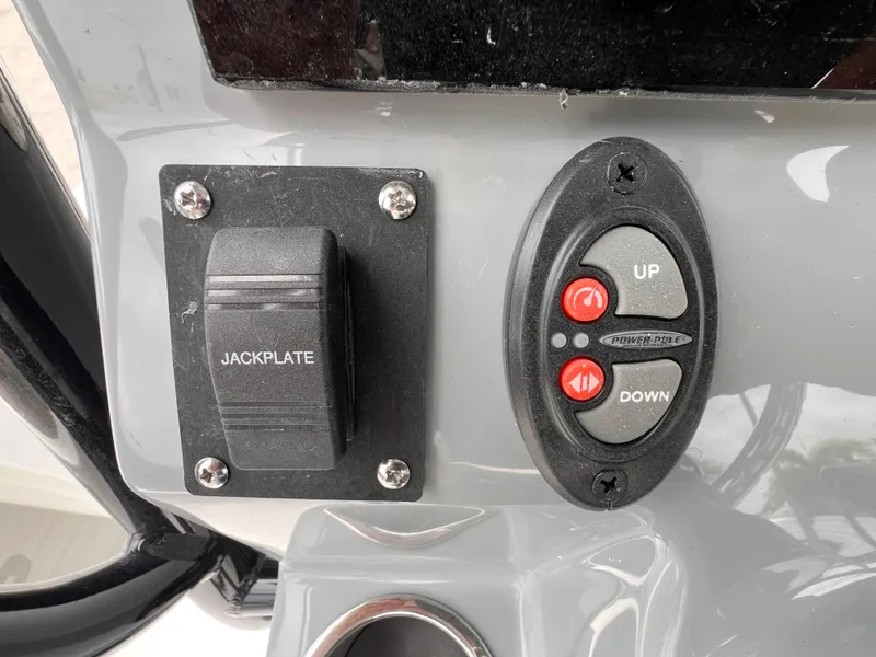 Slide: The Image of Control panel of 2026 Sea Pro 230 DLX with jackplate and Power-Pole buttons. - 14