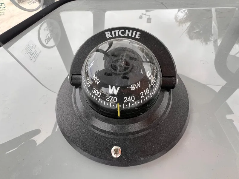 Slide: The Image of Ritchie compass on 2026 Sea Pro 230 DLX boat dashboard. - 19