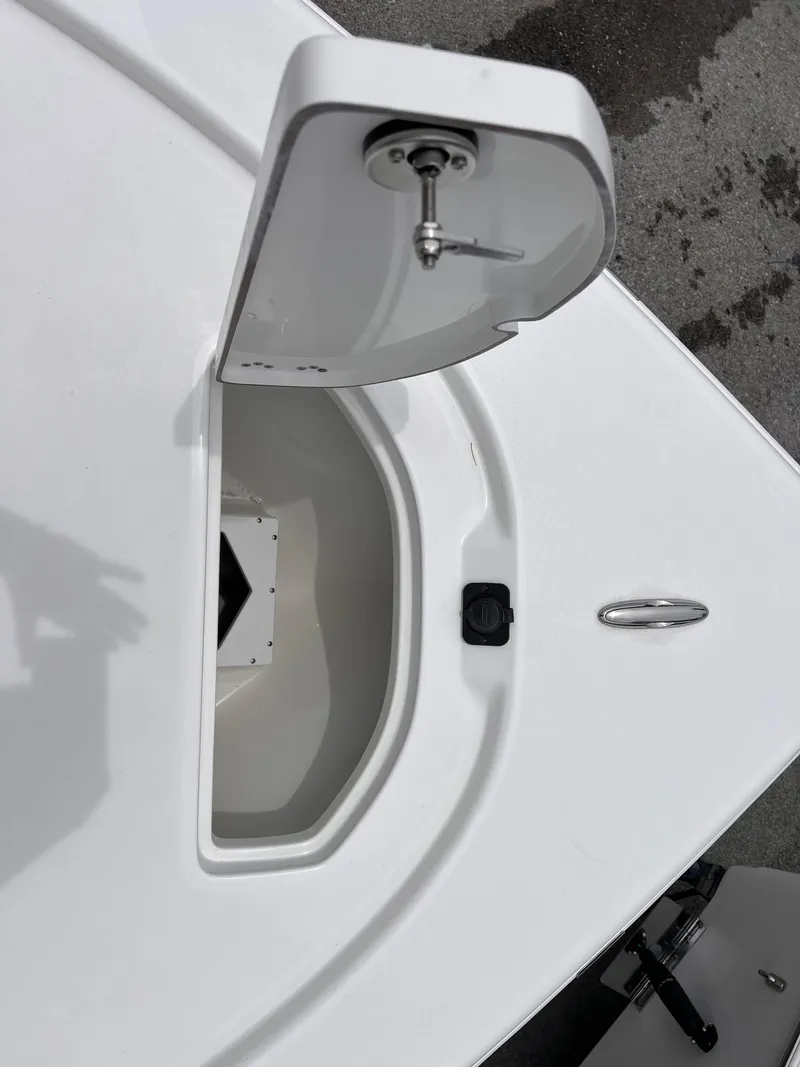 Slide: The Image of Open storage compartment on 2026 Sea Pro 230 DLX boat deck. - 29