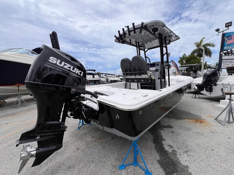 Slide: The Image of 2026 Sea Pro 230 DLX boat with Suzuki outboard motor on display. - 3