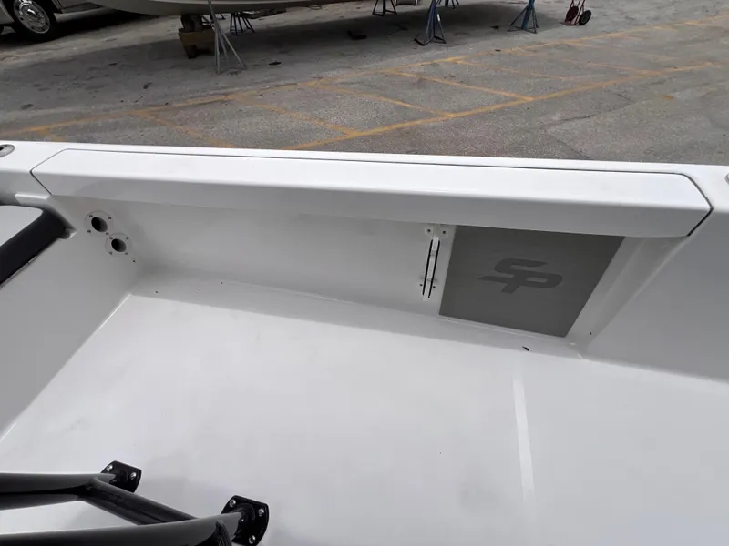 Slide: The Image of Interior view of 2026 Sea Pro 230 DLX boat, featuring sleek white design. - 44