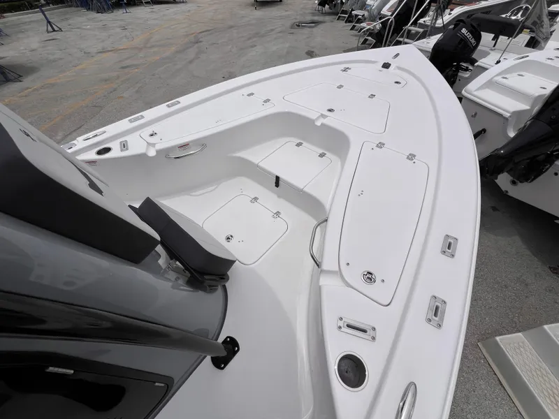 Slide: The Image of 2026 Sea Pro 230 DLX boat interior, featuring spacious seating and storage compartments. - 50