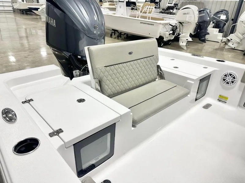 Slide: The Image of 2025 Sportsman MASTERS 247OE boat interior with Yamaha engine, featuring cushioned seating and storage compartments. - 13