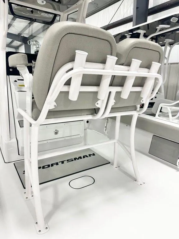 Slide: The Image of 2025 Sportsman MASTERS 247OE boat interior with dual seats and rod holders. - 5