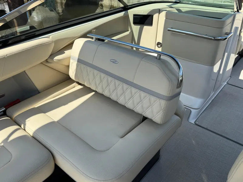 Slide: The Image of Luxurious interior of a 2021 Regal 2800 boat with cream leather seating. - 11