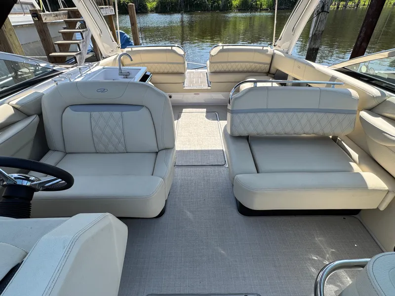 Slide: The Image of Luxurious interior of a 2021 Regal 2800 boat with plush seating and elegant design. - 12