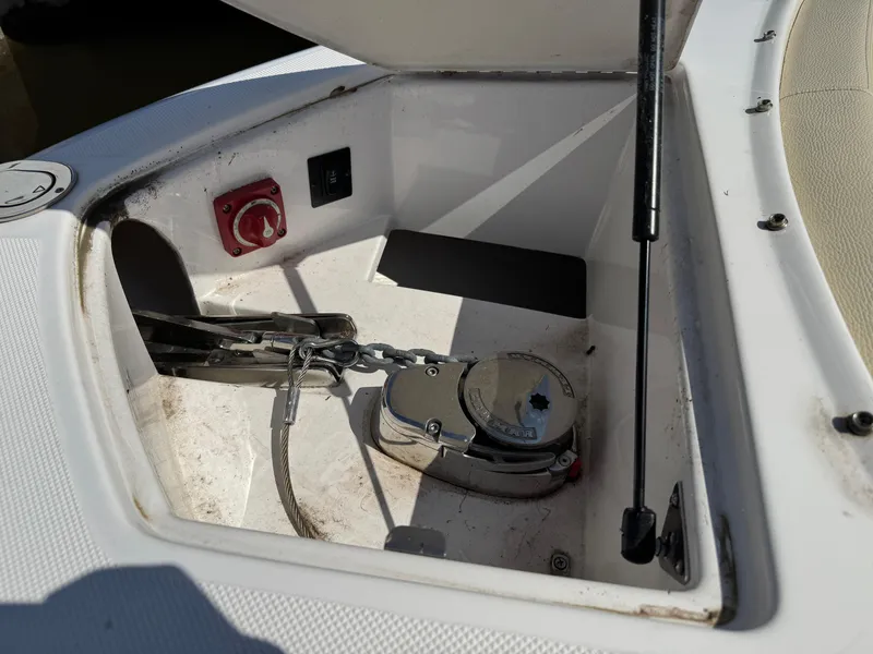 Slide: The Image of Anchor compartment of 2021 Regal 2800 boat with chain and winch system. - 14