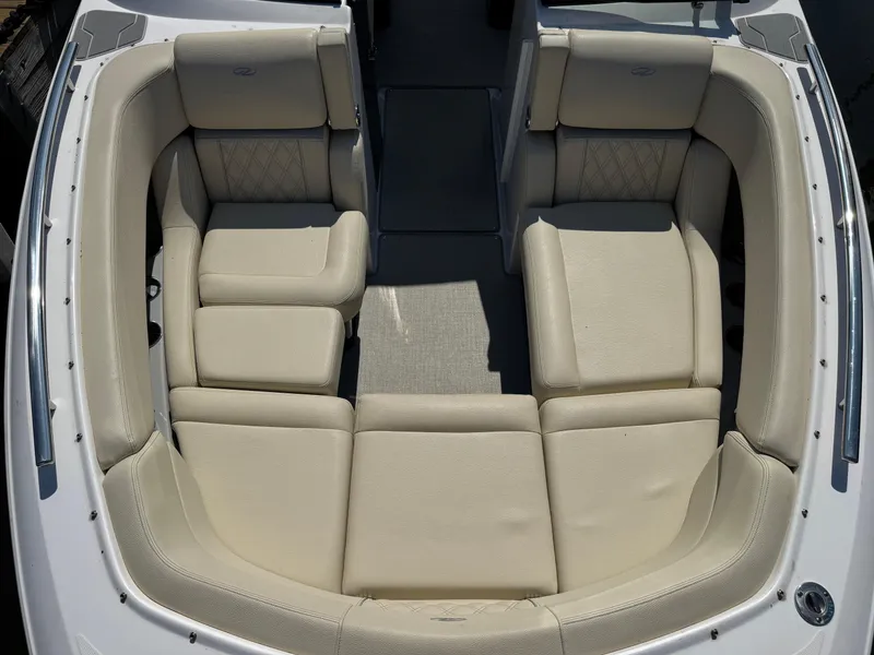 Slide: The Image of Luxurious seating area on a 2021 Regal 2800 boat, featuring cream leather upholstery. - 15