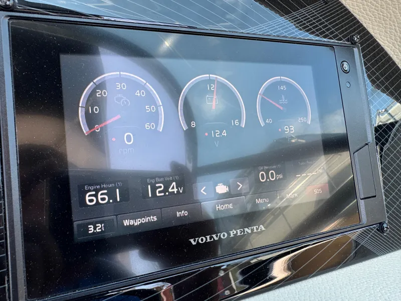 Slide: The Image of Volvo Penta display on 2021 Regal 2800 boat showing engine metrics and controls. - 16