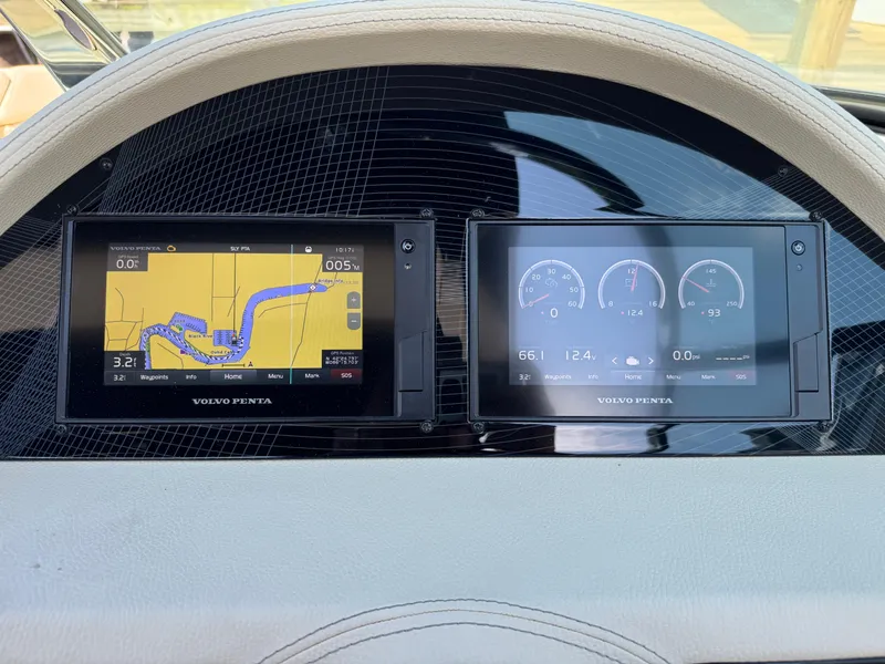Slide: The Image of Dashboard of a 2021 Regal 2800 boat featuring dual Volvo Penta displays. - 17
