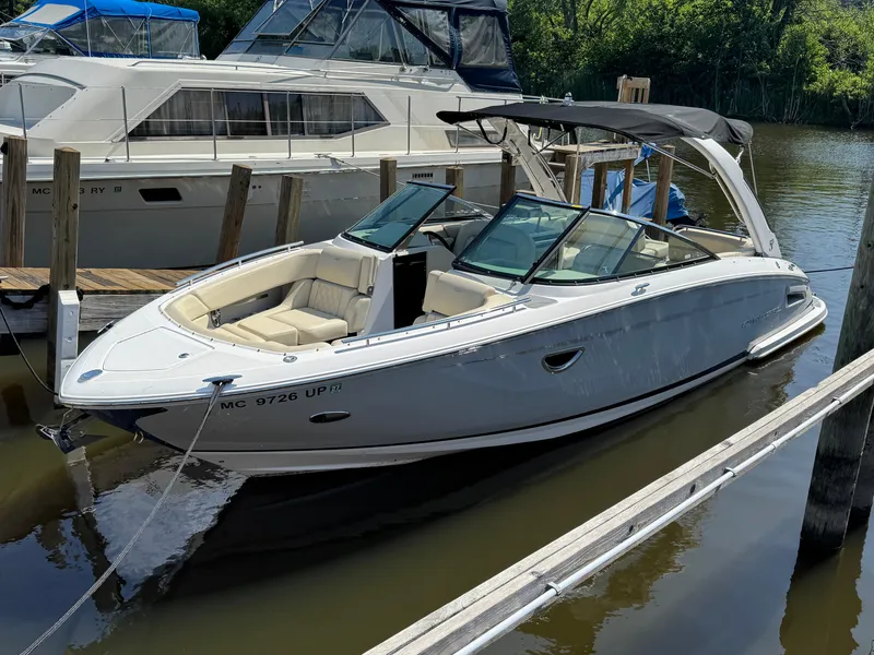 Slide: The Image of 2021 Regal 2800 boat docked, featuring sleek design and spacious seating. - 3