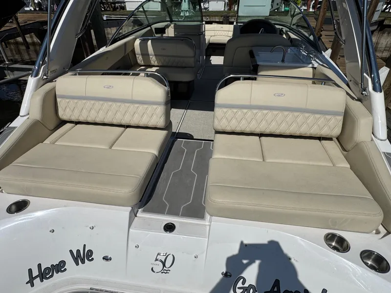 Slide: The Image of 2021 Regal 2800 boat interior with beige seating and sleek design. - 7