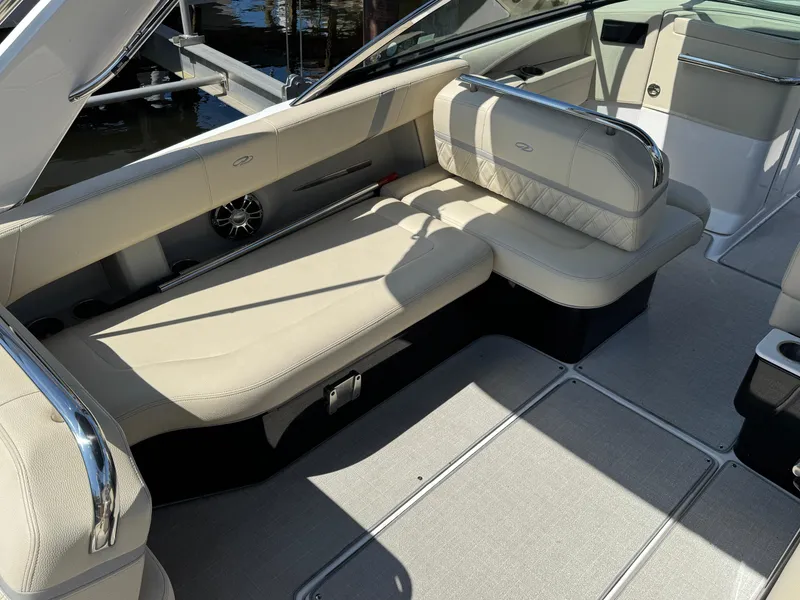 Slide: The Image of 2021 Regal 2800 boat interior with beige seating and modern design. - 9