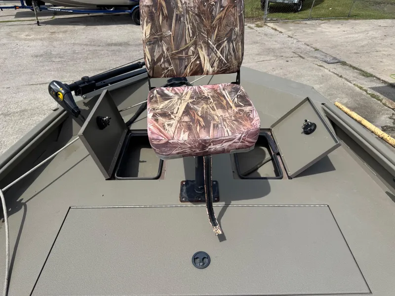 Slide: The Image of 2021 Alumacraft 2072 SC boat with camo seat and storage compartments. - 5