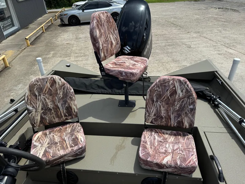 Slide: The Image of 2021 Alumacraft 2072 SC boat with camo seats and Suzuki outboard motor. - 8