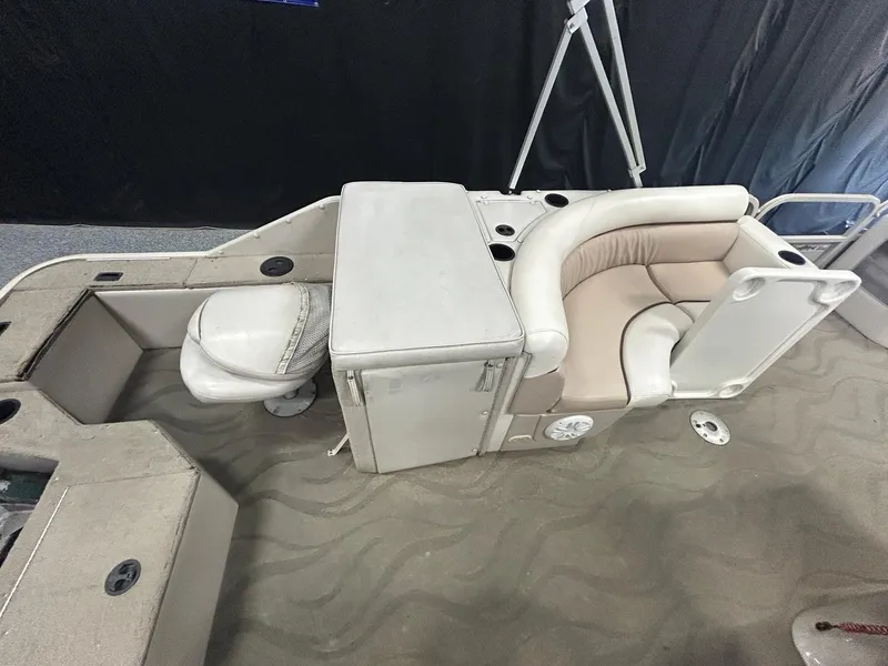 Slide: The Image of 2003 Crestliner LSi Angler 2485 boat interior with seating and storage compartments. - 13