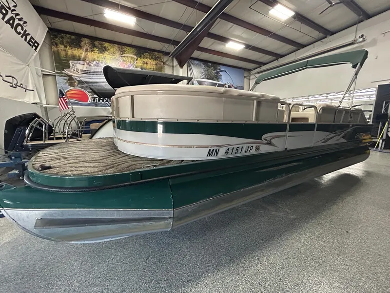 Slide: The Image of 2003 Crestliner LSi Angler 2485 pontoon boat in indoor showroom. - 3