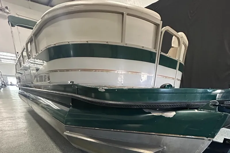 Slide: The Image of 2003 Crestliner LSi Angler 2485 pontoon boat in indoor storage. - 6