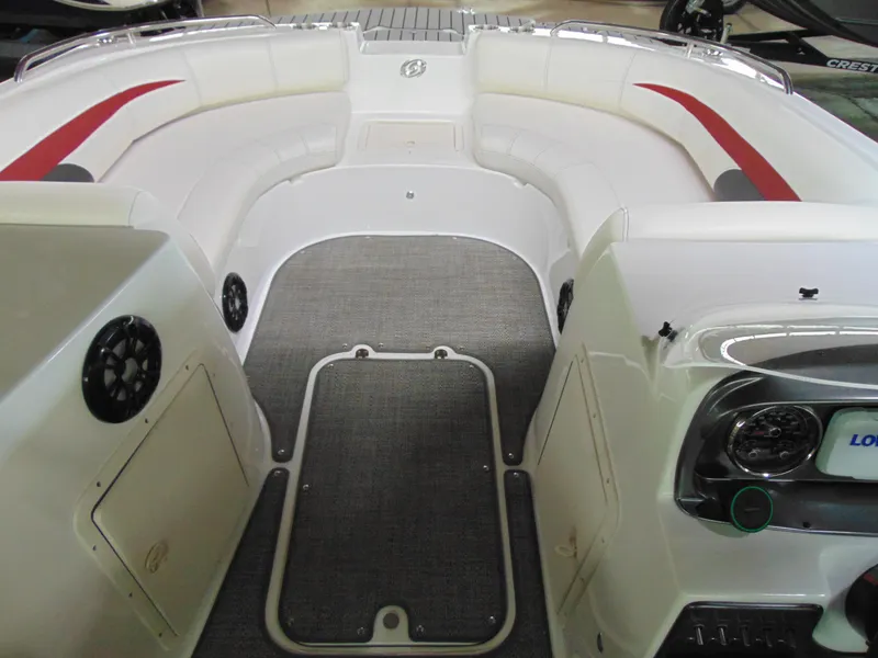 Slide: The Image of 2021 Hurricane SunDeck Sport 188 IO boat interior with white seating and red accents. - 10