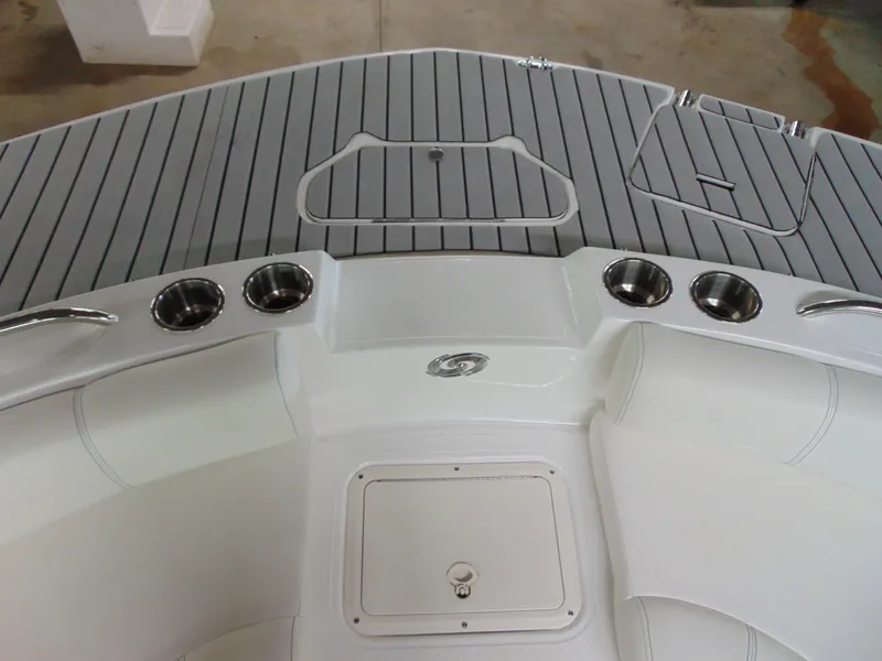 Slide: The Image of 2021 Hurricane SunDeck Sport 188 IO boat deck with cup holders and storage compartments. - 12