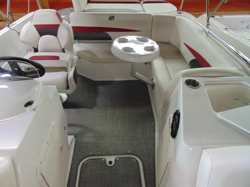 Slide: The Image of 2021 Hurricane SunDeck Sport 188 IO interior with seating, table, and steering console. - 13
