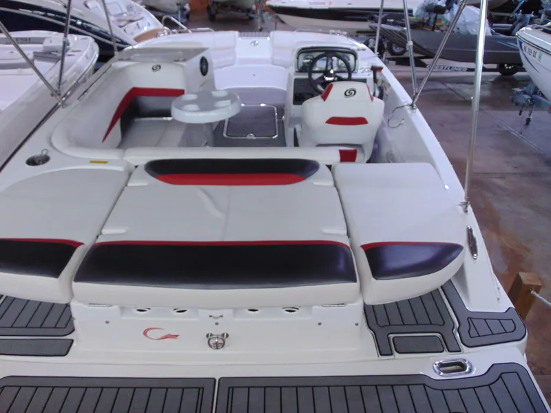 Slide: The Image of 2021 Hurricane SunDeck Sport 188 IO boat interior with seating and steering wheel. - 5